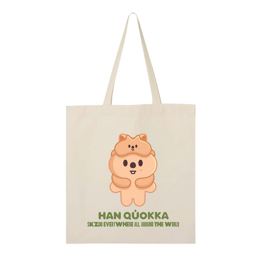 Beige tote bag with a cartoon character and text 