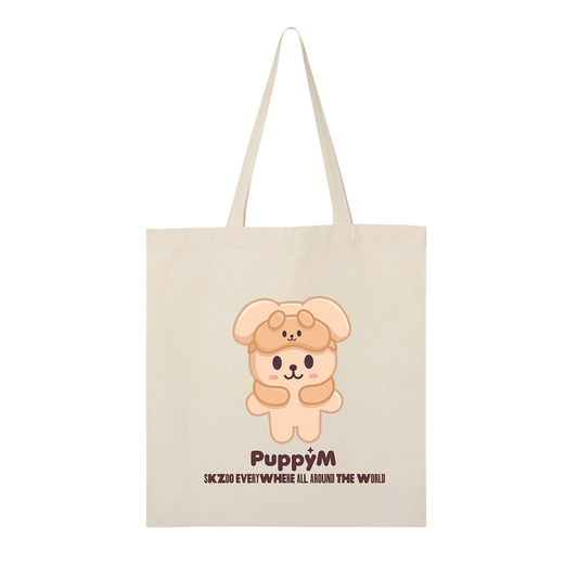 Beige tote bag with a cartoon dog design and text 